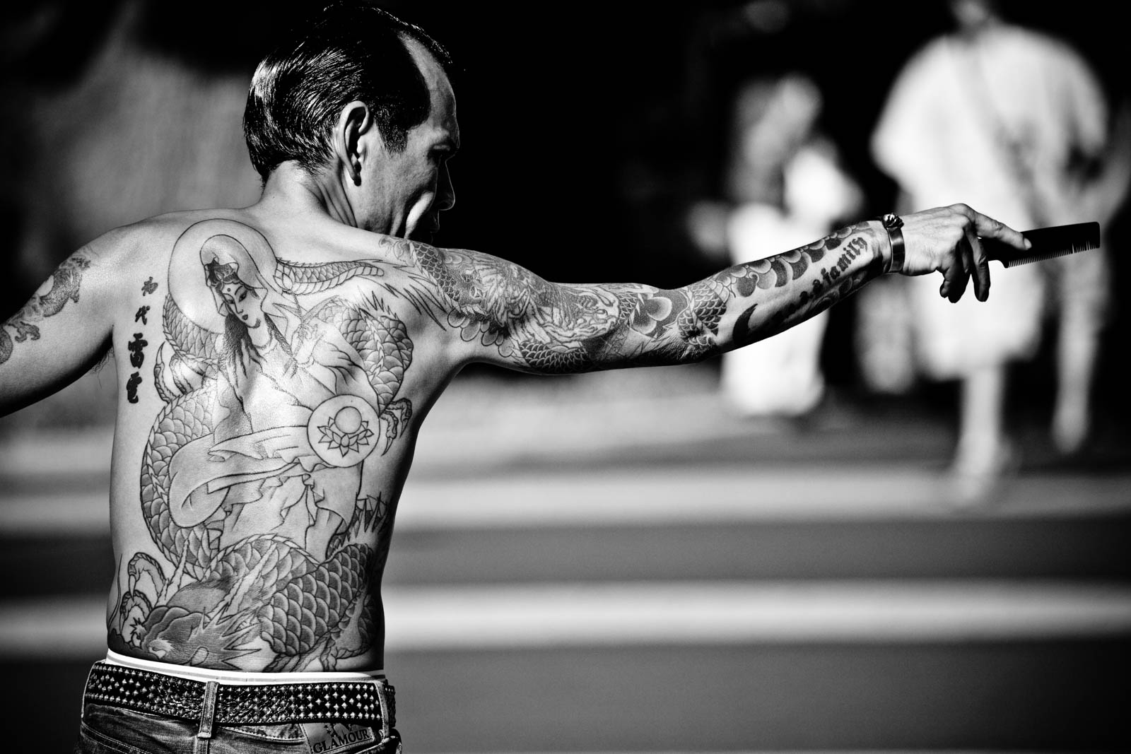 Rock-a-Billy at YoYogi Park, Tokyo, full with tattoos dancing. Street Photography by Victor Borst