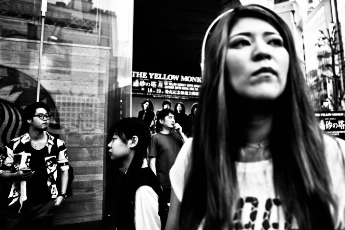 Japanese people at Shibuya looking at different direction at Starbuck. Street Photography by Victor Borst