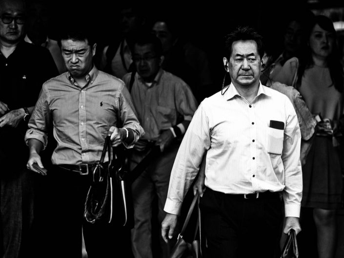 Dirty looking man and one with headphones at Shimbashi station. Street Photography by Victor Borst